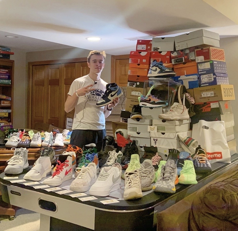 Drew with his sneaker collection and shoe box stacks